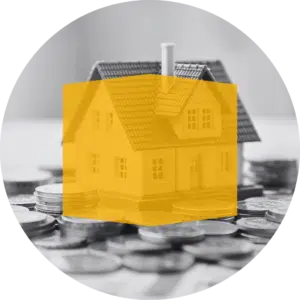 toy house sitting on money